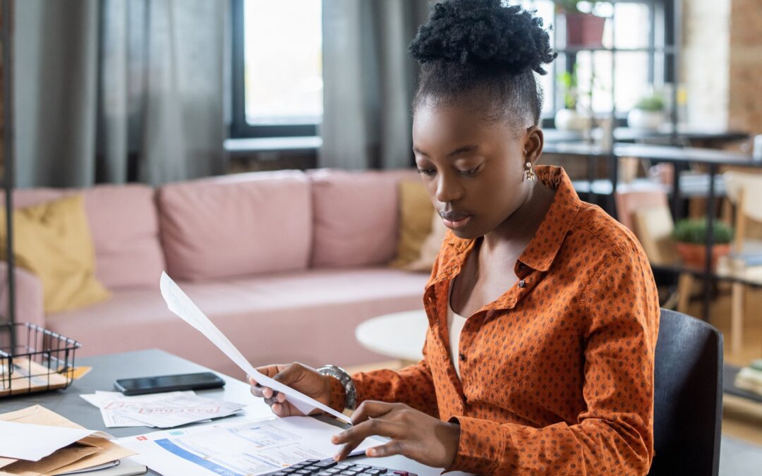 Blackwoman Calculating Tax Bill