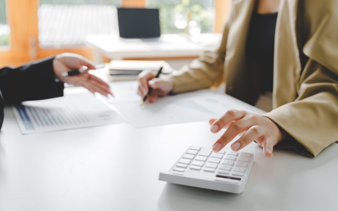 Teamwork with price chart analyzes business people on the table at the conference room.